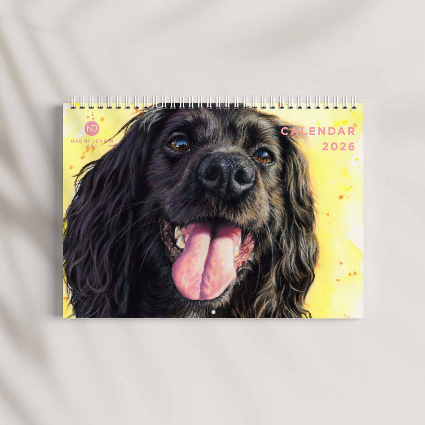 2026 Calendar with a dog's face on a yellow background - Naomi Jenkin Art