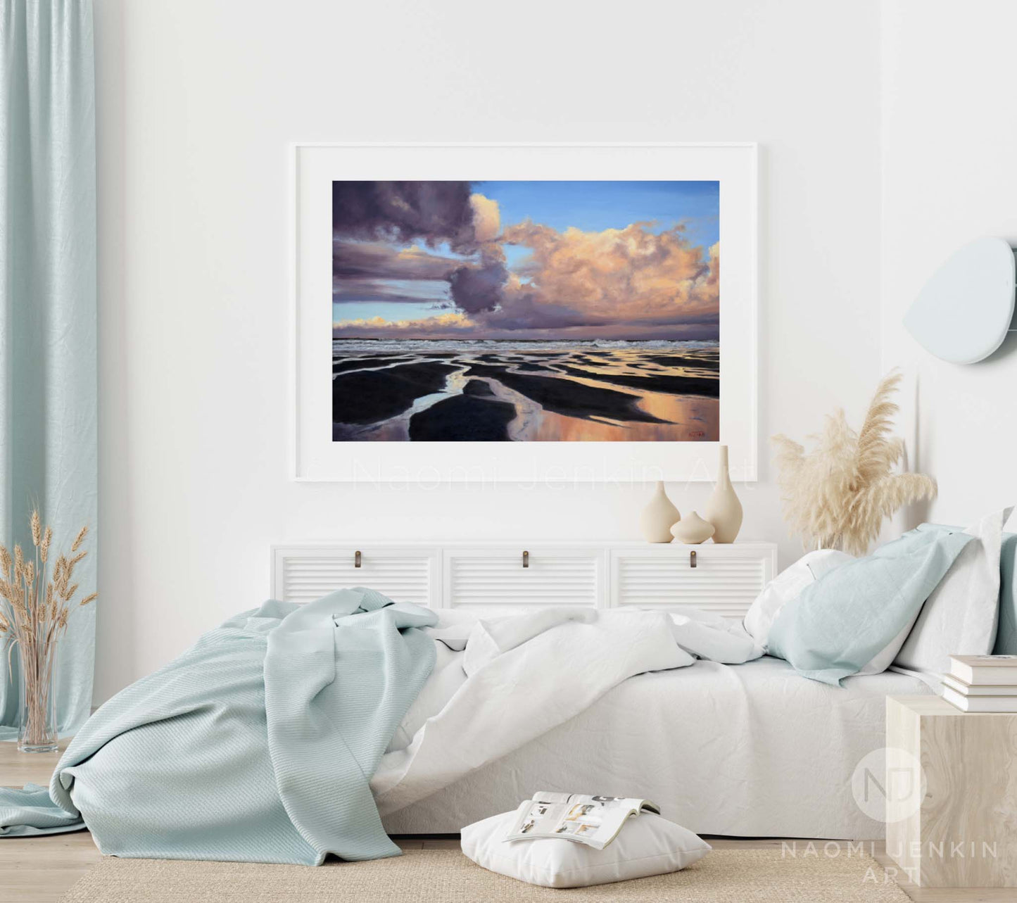 Framed beach print by Naomi Jenkin Art in a bedroom setting..