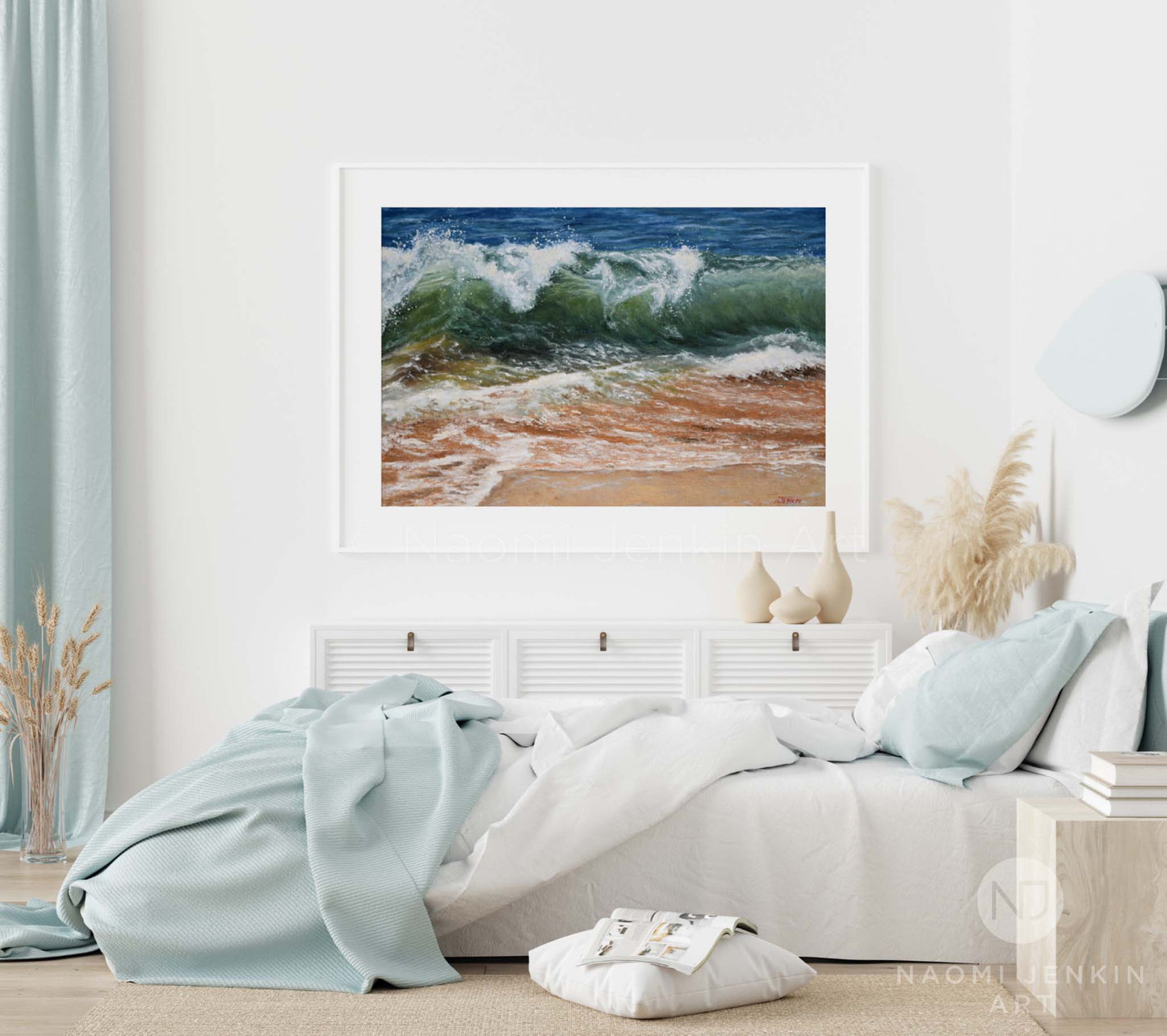 Framed wave print in a bedroom setting by seascape artist Naomi Jenkin Art