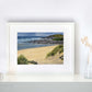 Autumn Showers Fistral' seascape print by Naomi Jenkin in a white frame