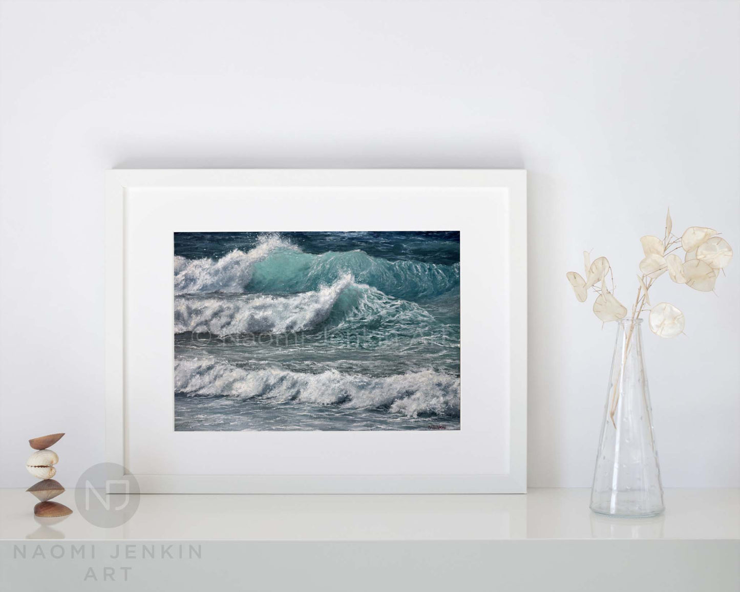 Framed wave seascape print 'Whitewater Waves' by seascape artist Naomi Jenkin on a shelf setting