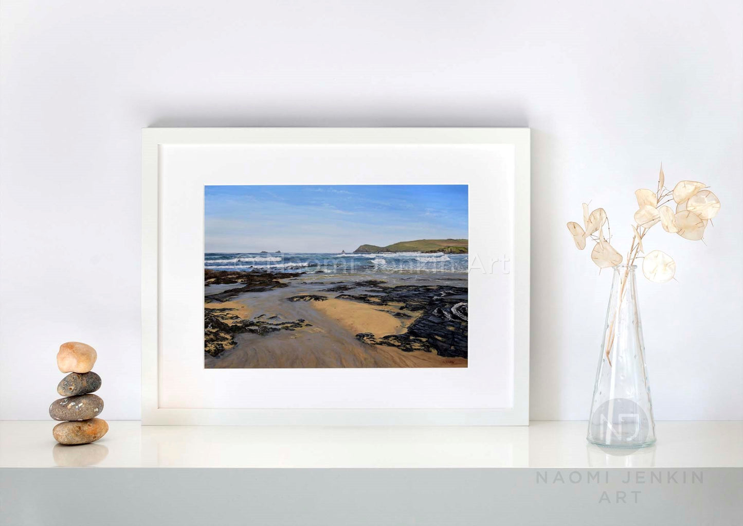 Beach print of Constantine Bay by Naomi Jenkin in a white frame