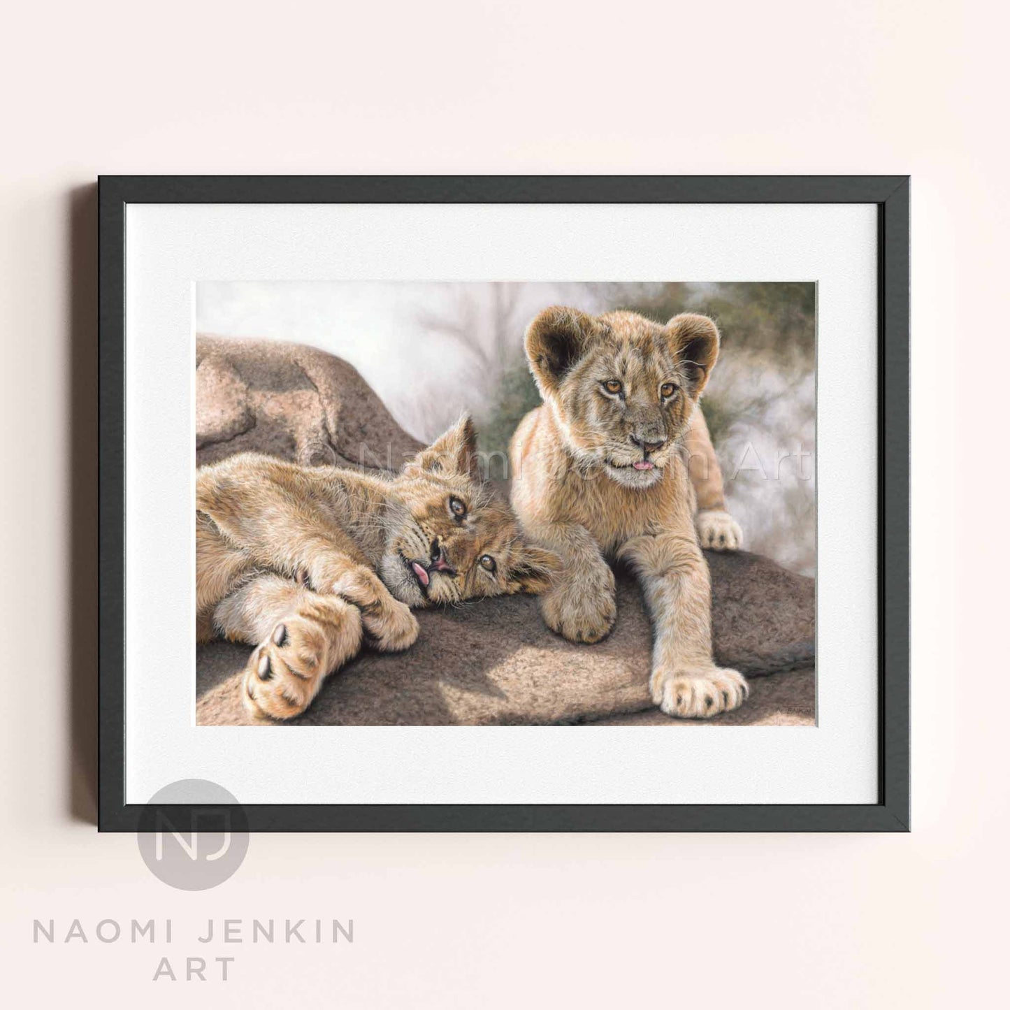Framed lion cub painting by wildlife artist Naomi Jenkin