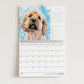 2026 Calendar with a cockerpoo dog on a blue background - Naomi Jenkin Art