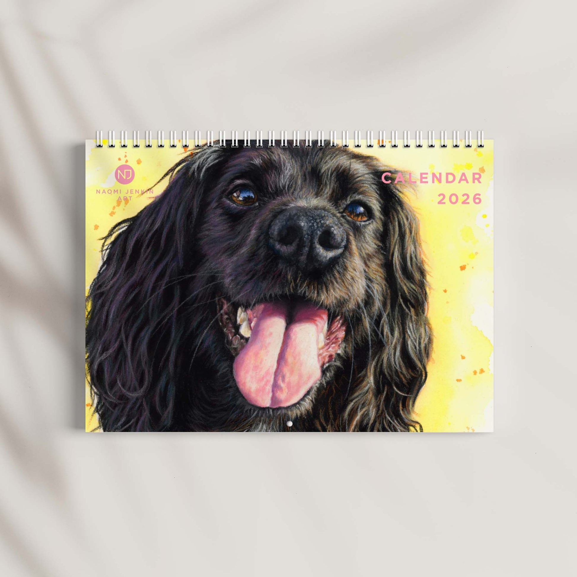 2026 Calendar with a dog's face on a yellow background - Naomi Jenkin Art