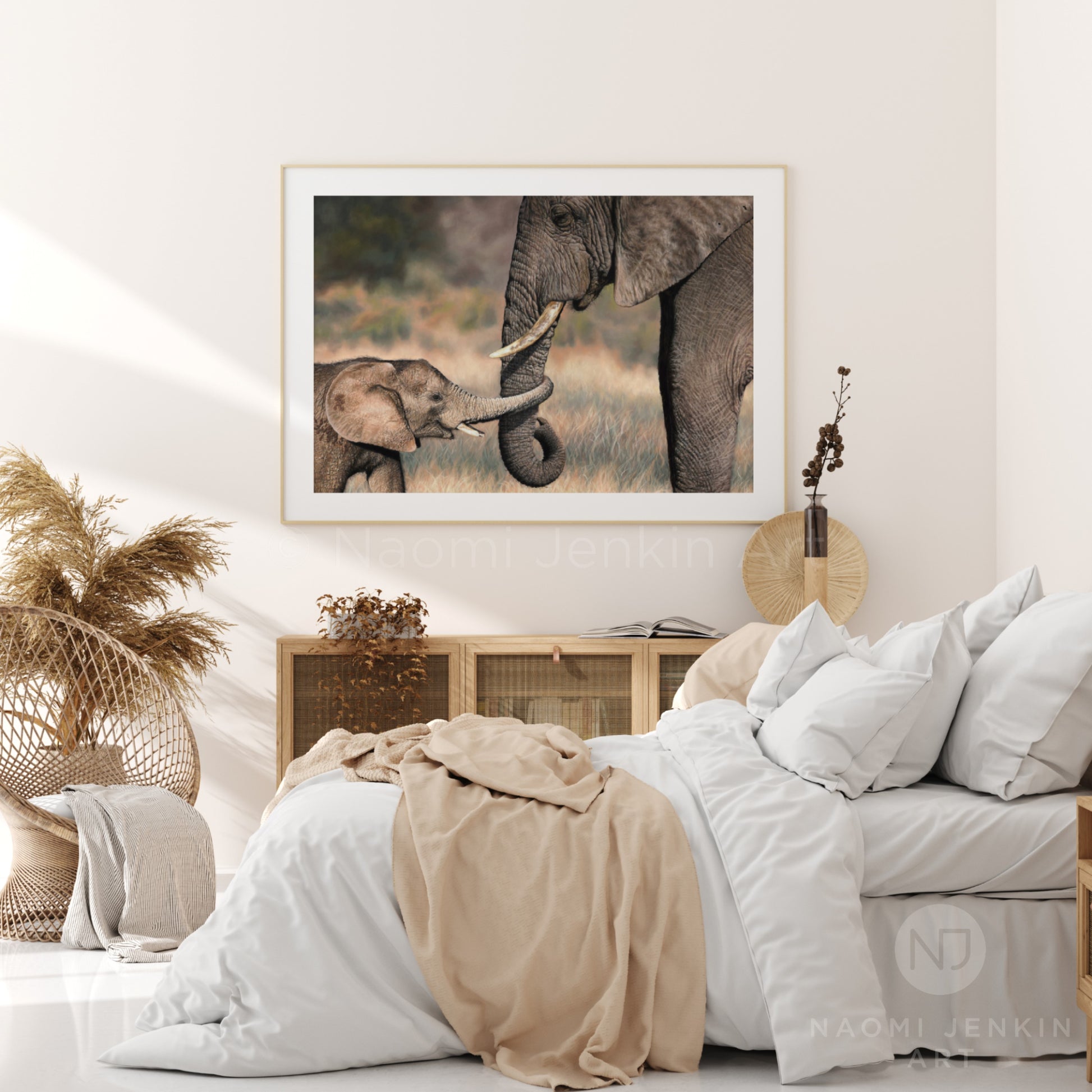 Framed elephant art by wildlife artist Naomi Jenkin in a bedroom setting.