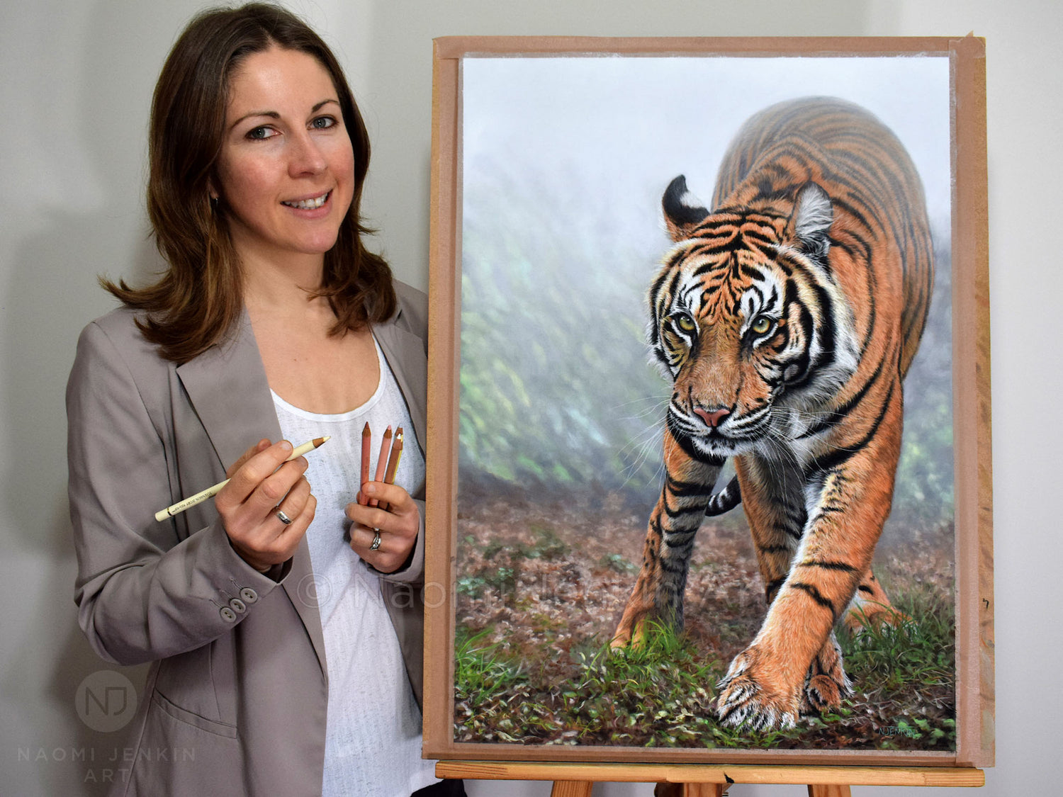 Wildlife artist Naomi Jenkin with original tiger drawing "Stealth".