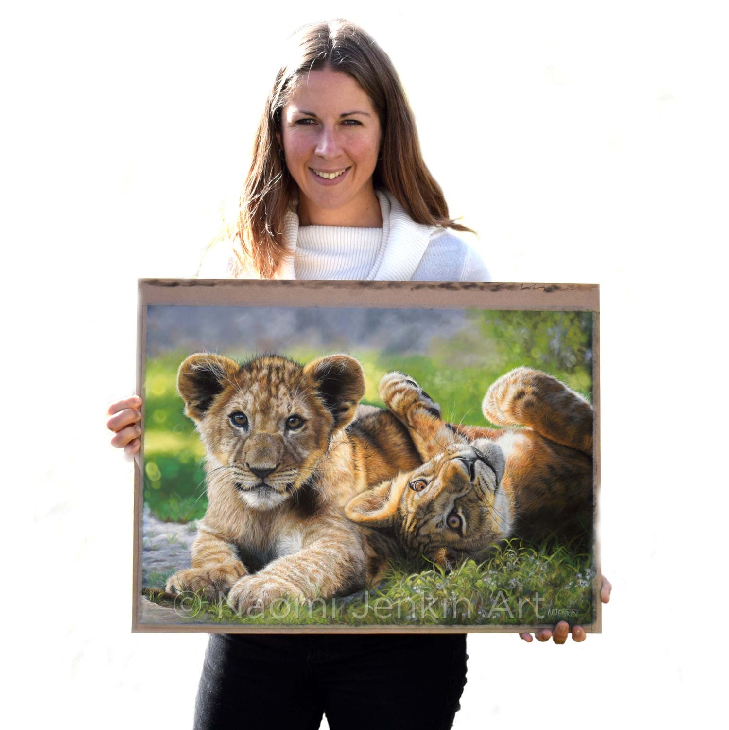 Wildlife artist Naomi Jenkin with her original lion painting "Lyin' Around".