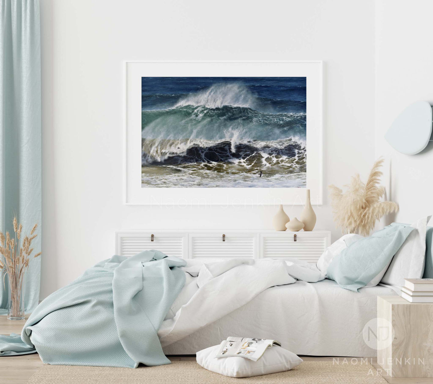 Ocean print 'Raging Seas' by seascape artist Naomi Jenkin Art in a white frame and bedroom setting. 