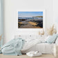 Beach print of Constantine Bay by Naomi Jenkin in a white frame and bedroom setting.