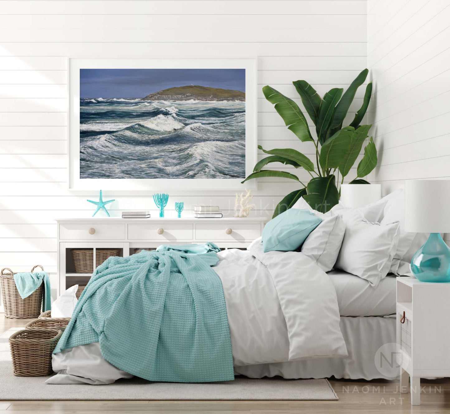 Seascape print of Fistral Beach in a bedroom setting by artist Naomi Jenkin Art in a white frame