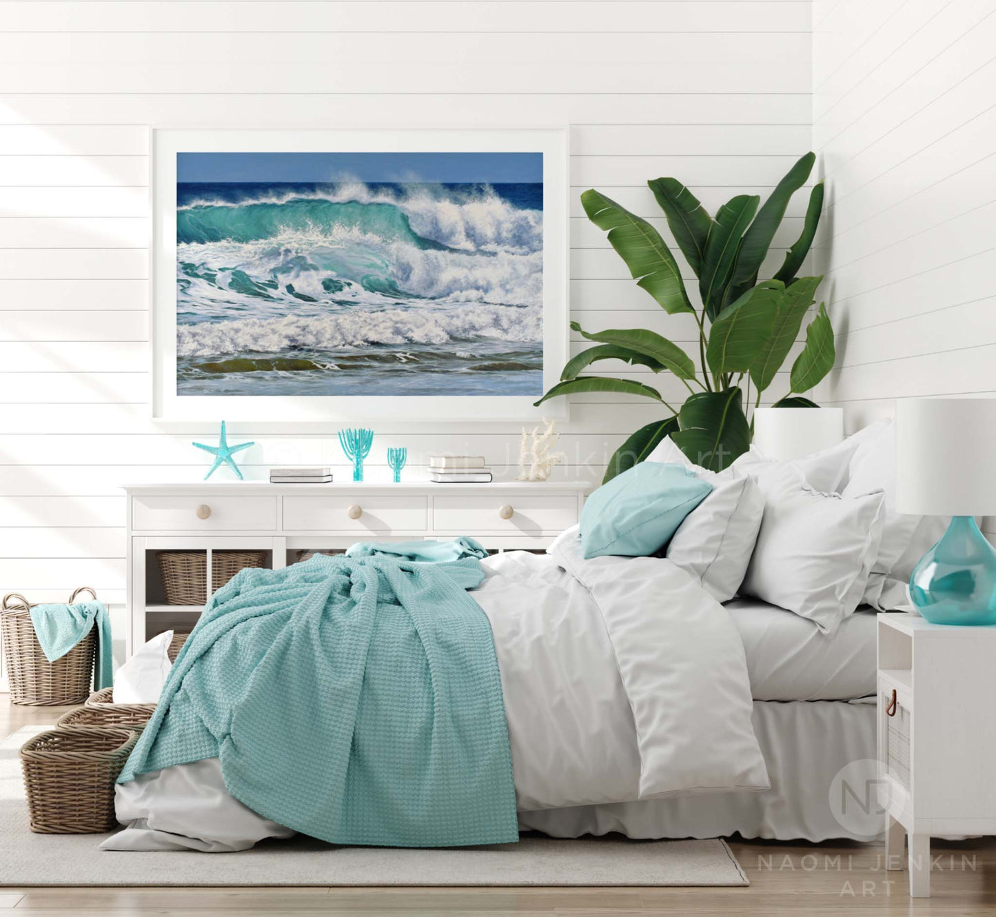 Framed wave art print by seascape artist Naomi Jenkin in a bedroom setting.
