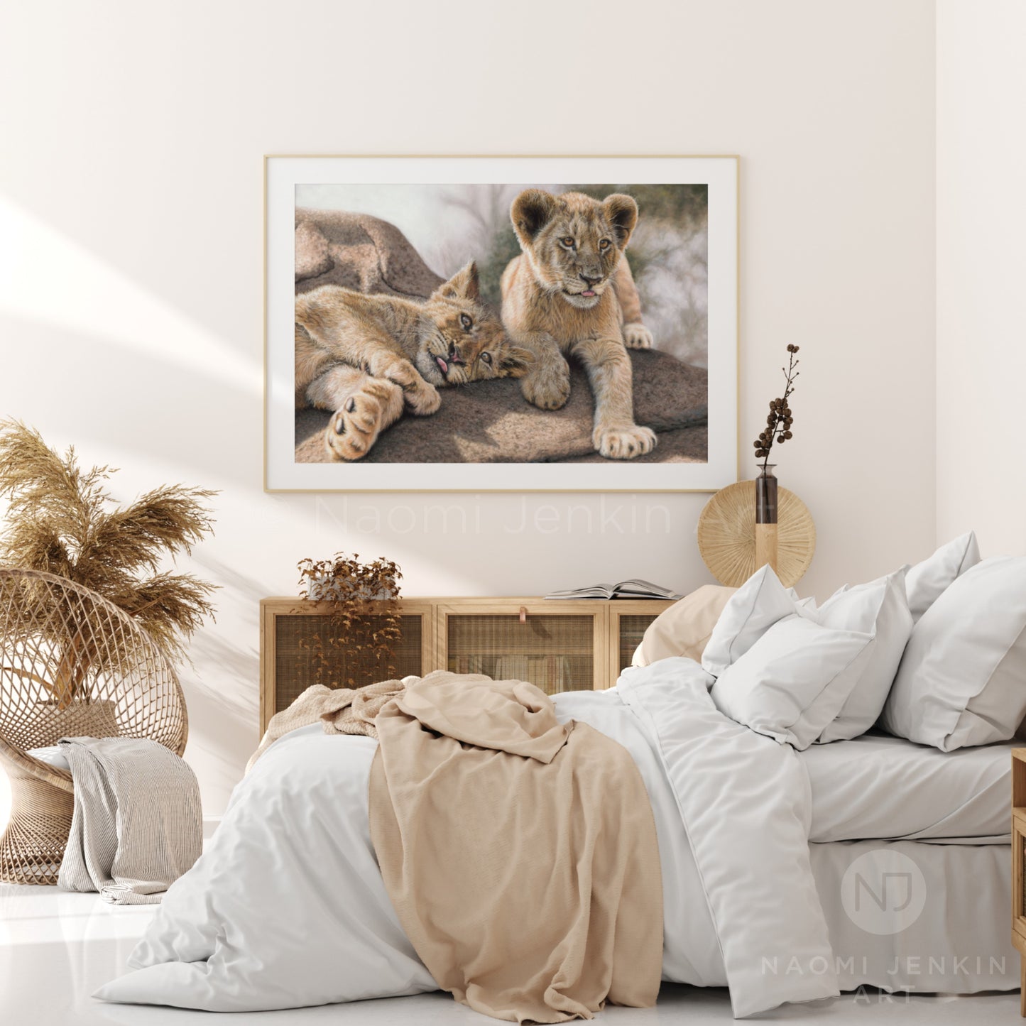 Framed lion cubs print by wildlife artist Naomi Jenkin Art in a bedroom setting