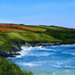 Close up of an original oil painting by Naomi Jenkin of Crantock Bay in Cornwall, viewed from the coast path with a sunlit blue sea and red poppy fields.