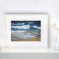 Framed fine art seascape print 'Stormy Seas, Constantine' on a shelf setting 