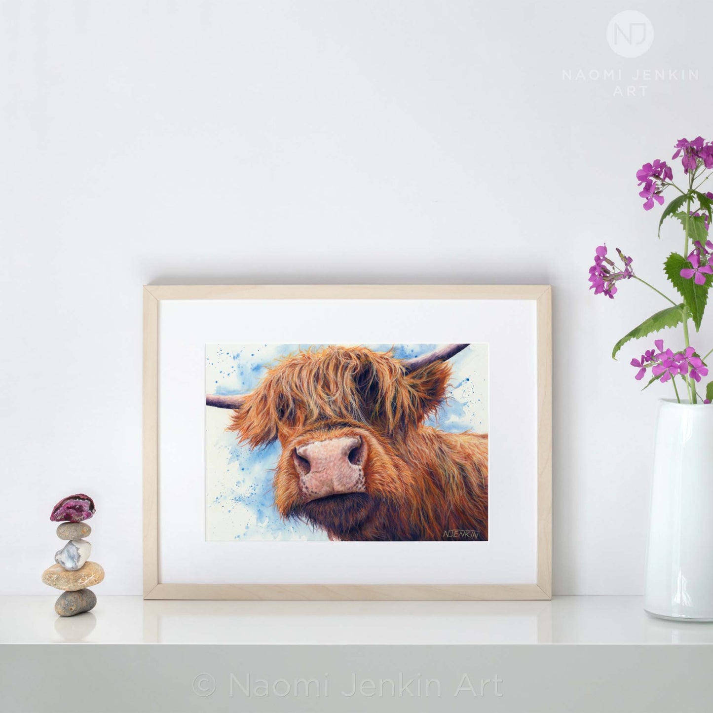 Highland cow art "Bad Hair Day" by Naomi Jenkin Art displayed in a light wooden frame.