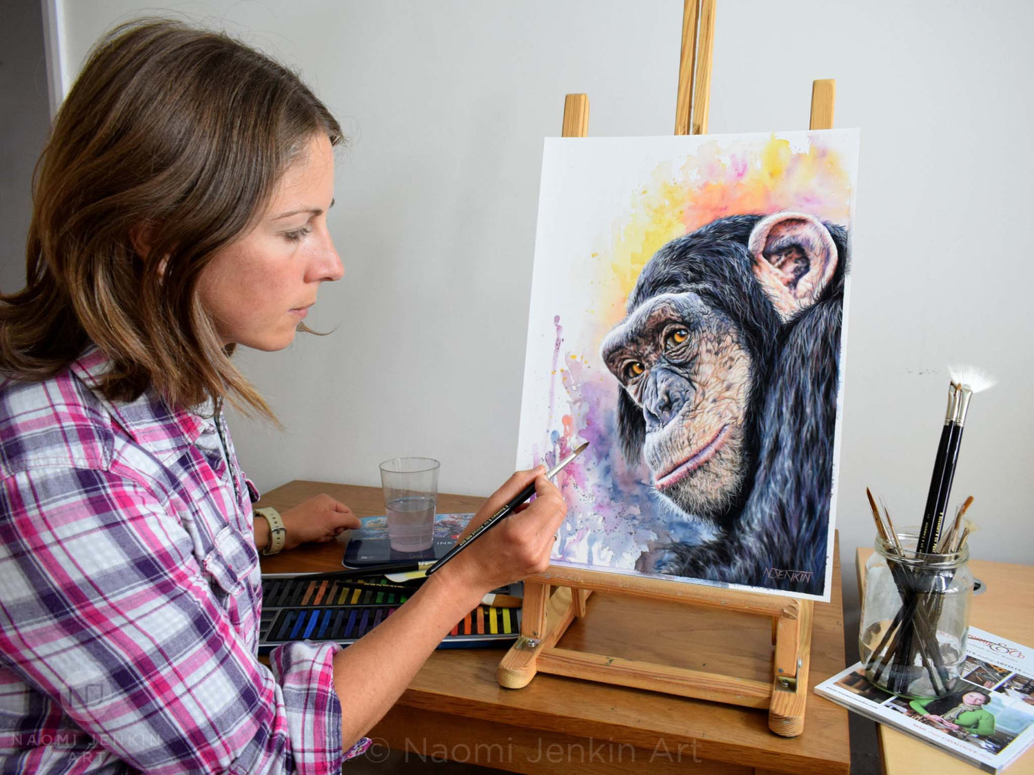 Wildlife Artist Naomi Jenkin creating her original chimpanzee painting "Kindred Spirit" 