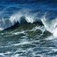 Original oil painting by Naomi Jenkin of a large breaking wave on a stormy North Cornish sea, with spray blown back by offshore winds, painted in deep blues and greens.