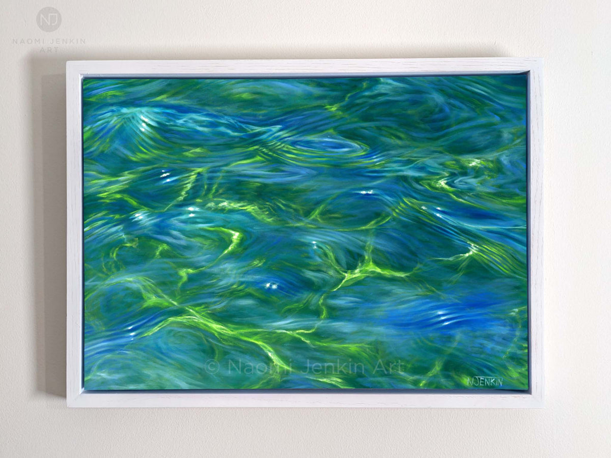 Ripples - original oil painting of shallow water by Naomi Jenkin. Framed in a white wooden tray frame.