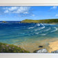Framed original oil seascape painting by Naomi Jenkin of Crantock Bay, Cornwall in summer, showing turquoise sea with swell curving into the bay at high tide, sea pinks flowering in the foreground, and Pentire Headland and Goose Rock in the distance