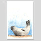 Art print of a common seal relaxing on the beach with a blue painted background. Artist - Naomi Jenkin. 