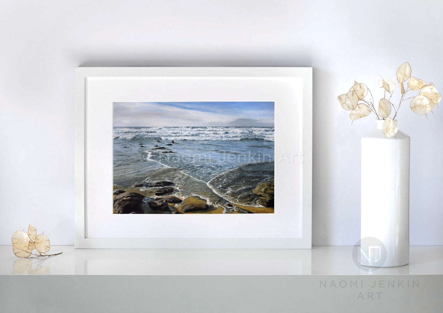 Watergate Bay print titled 'Incoming Tide' by artist Naomi Jenkin Art in a white frame