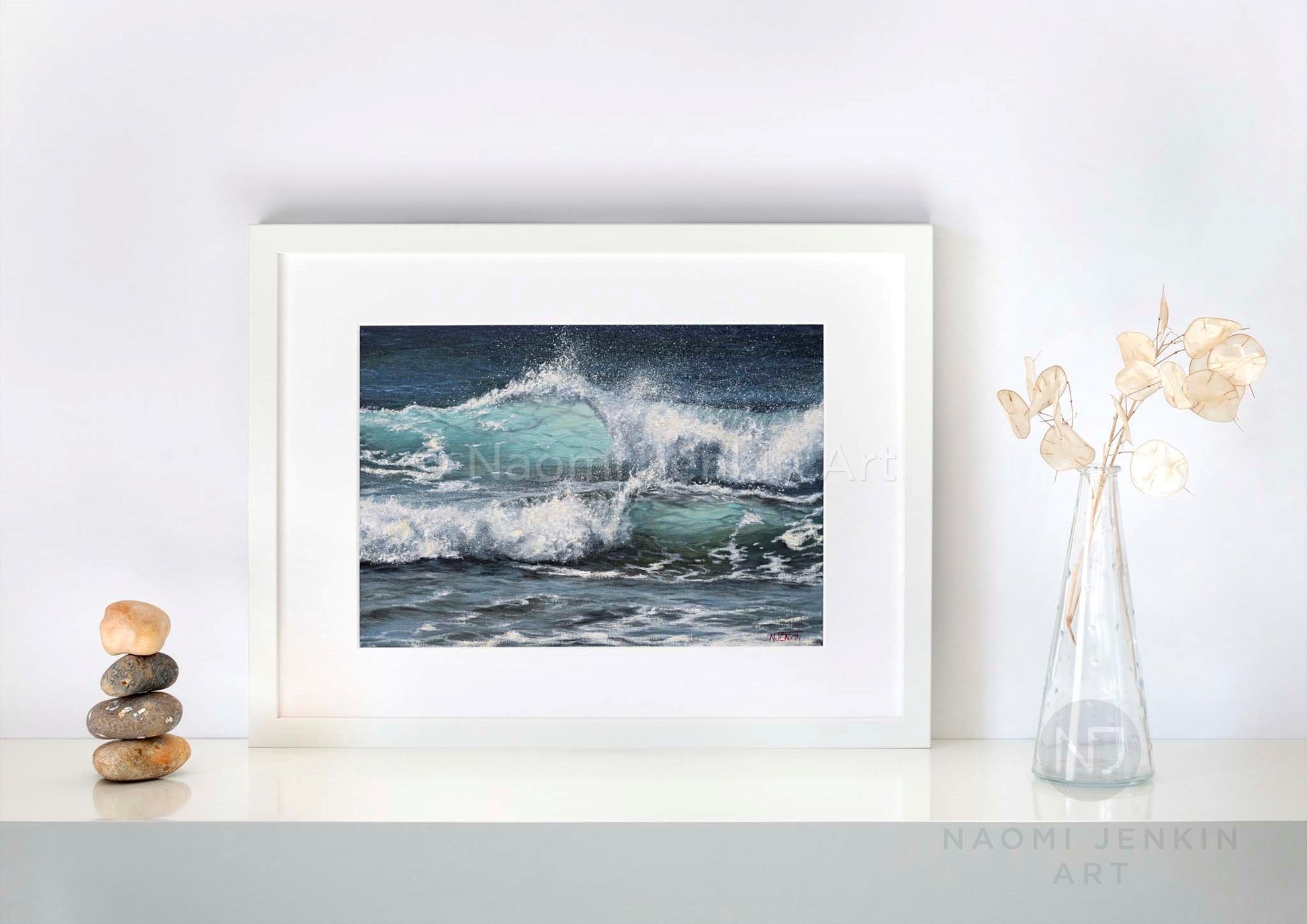 Framed wave seascape print 'Sunlit Surf' by seascape artist Naomi Jenkin on a shelf setting